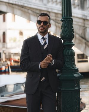 Intense Brown Three-Piece Suit with Striped Tie