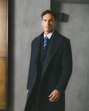 Dark Navy Overcoat with Three-Piece Suit and Striped Tie