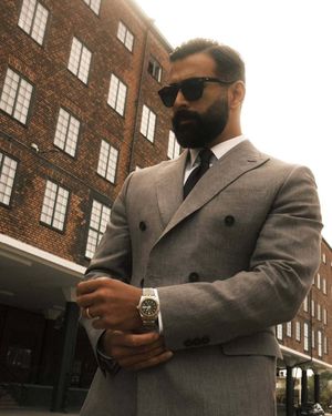 Grey Double-Breasted Suit with White Shirt and Black Tie