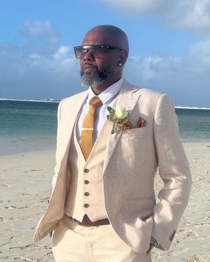 Ivory Linen Three-Piece Suit with White Shirt and Mustard Tie