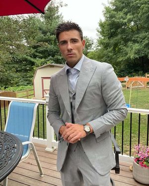 Light Grey Pinstriped Three-Piece Suit with Blue Tie