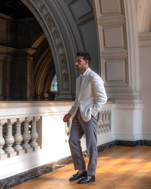 White Blazer with Grey Trousers and Tassel Loafers