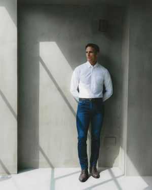 White Button-Up Shirt with Dark Blue Jeans