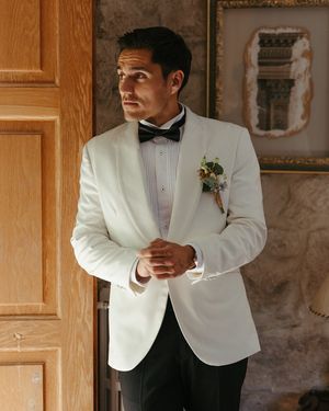 White Tuxedo Jacket with Black Trousers and Bow Tie